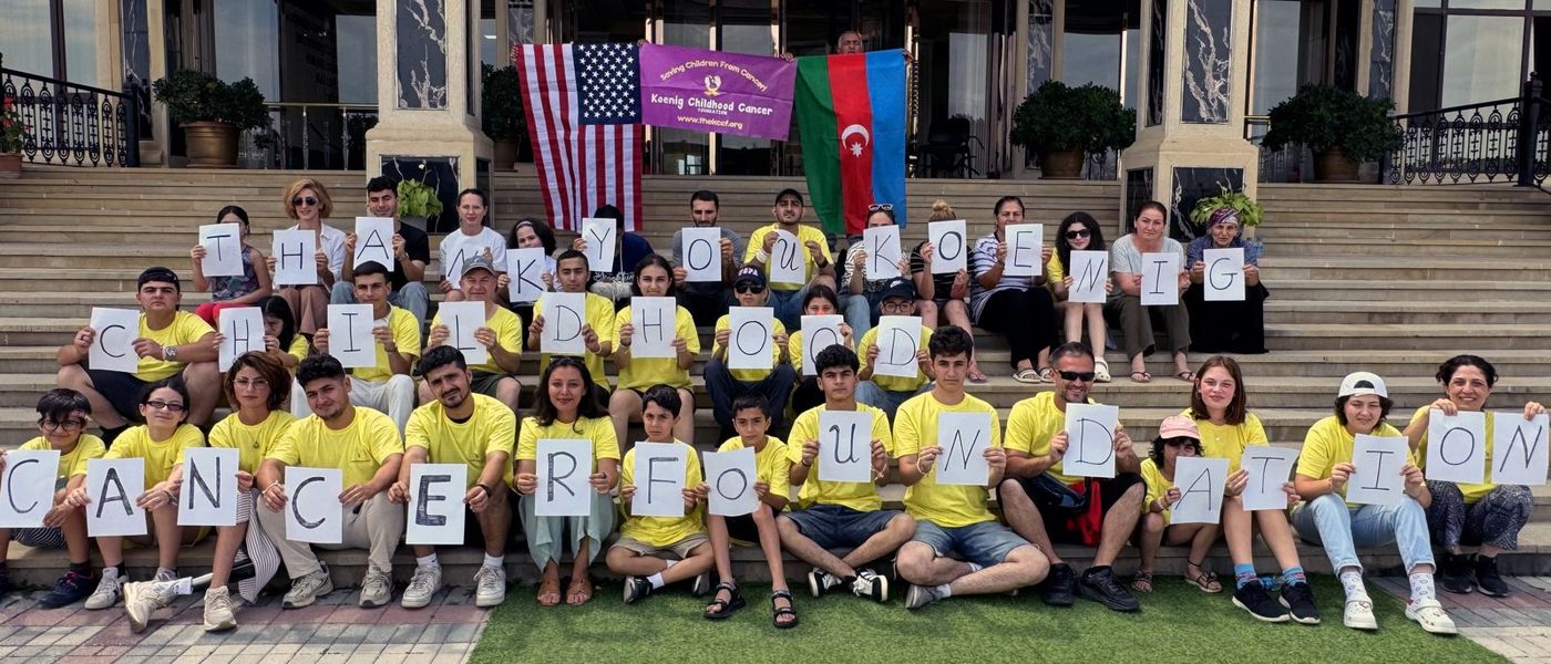 Campers holding letters that spell a thank-you to Koenig Childhood Cancer Foundation